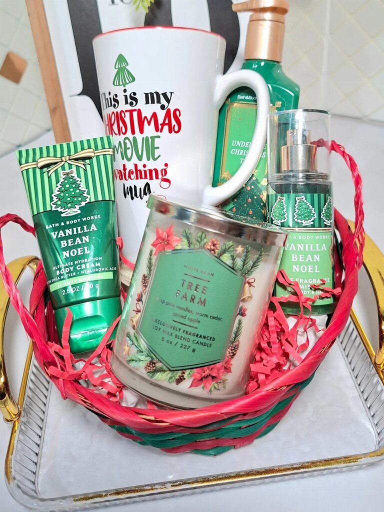 Christmas gift basket with a movie themed mug, scented candle, and body care products.