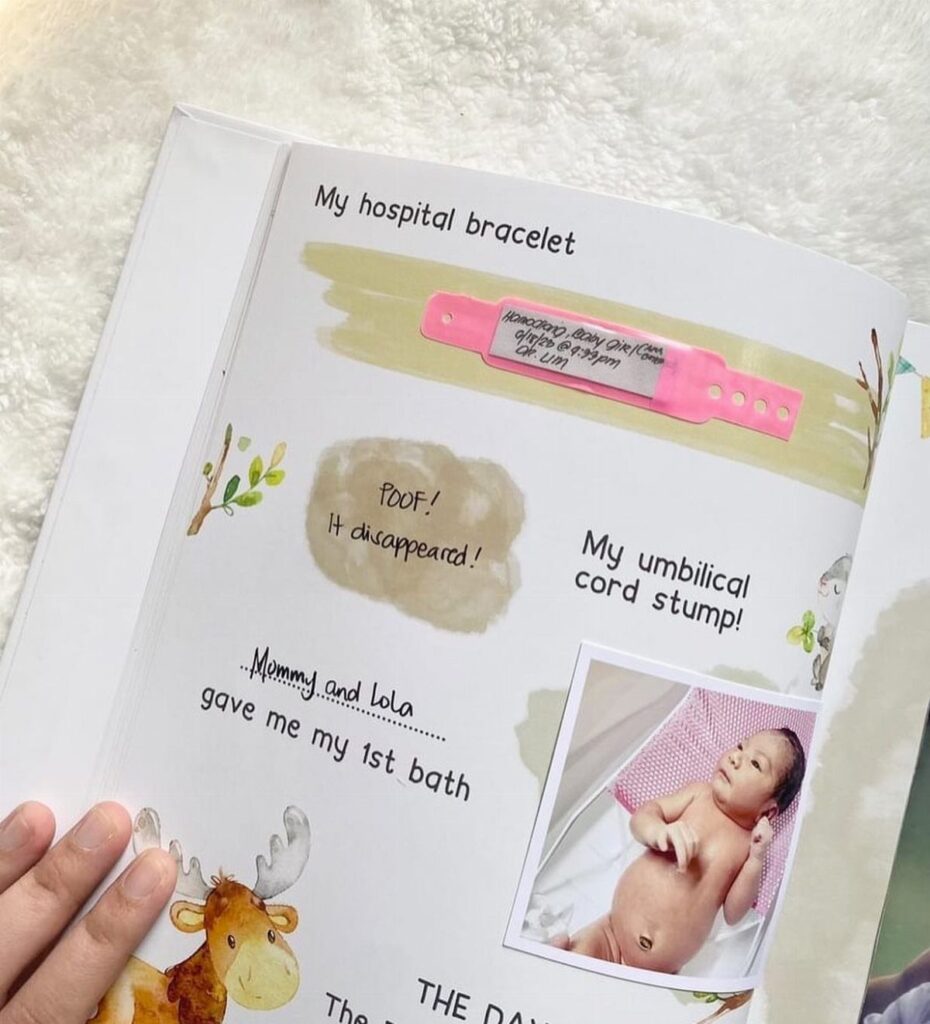 Open baby memory book with a hospital bracelet and newborn baby photograph.