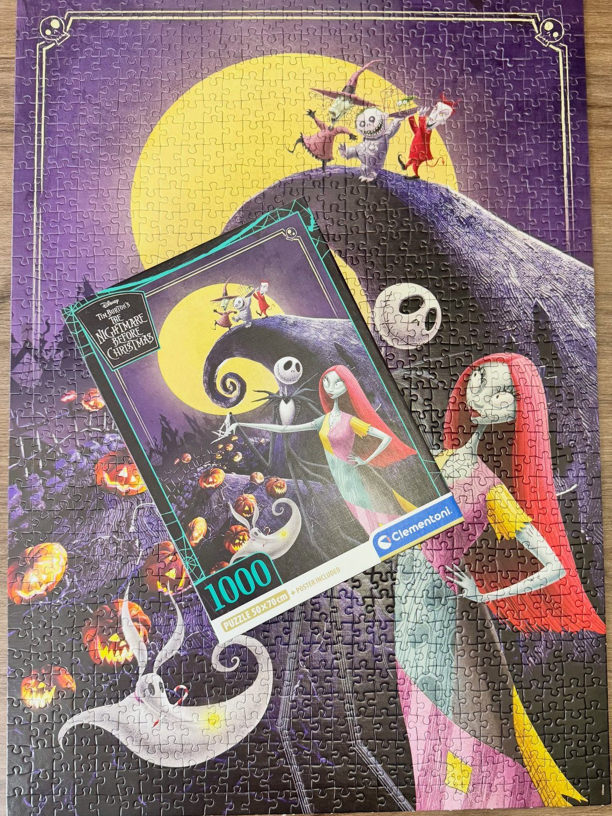 Nightmare Before Christmas jigsaw puzzle with Jack and Sally and the product box.