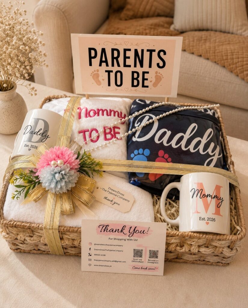 Woven gift basket with Mommy and Daddy towels, mugs, and Parents To Be sign.